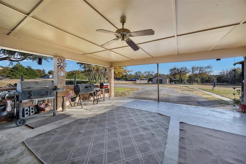 717 Houston Street Anna, TX 75409 - Photo 15 of 25 a view of a patio with table and chairs
