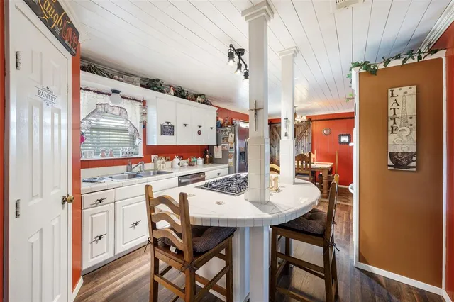a kitchen with a table and chairs