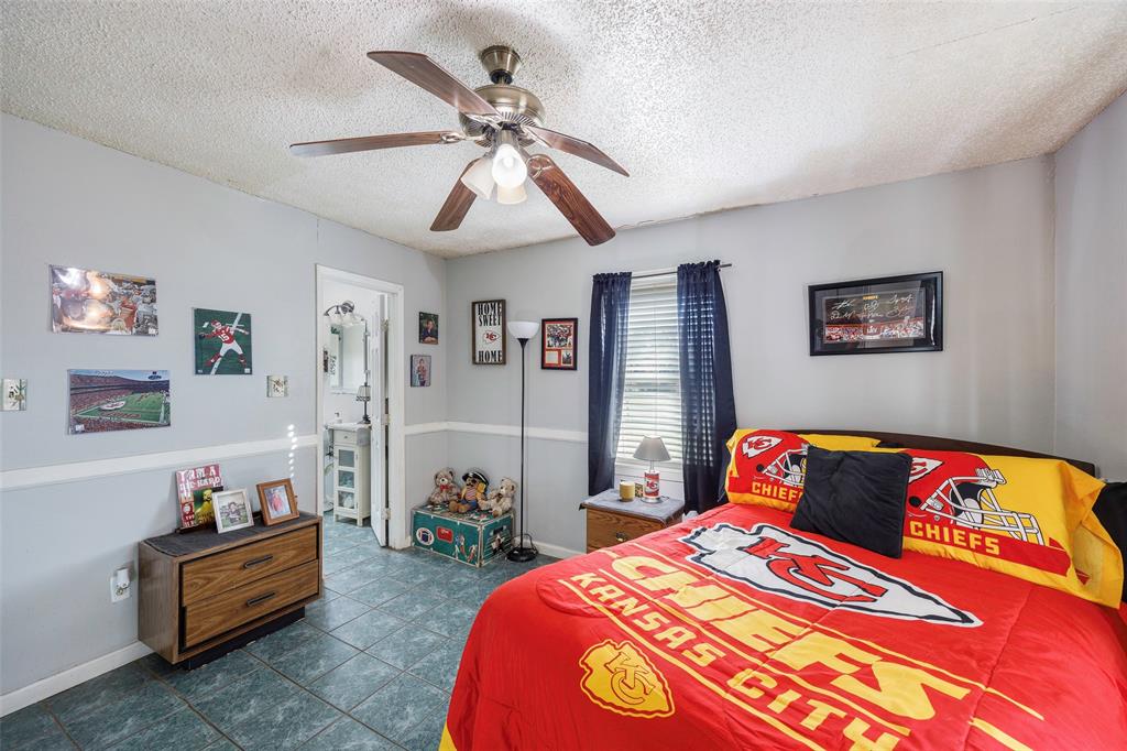 717 Houston Street Anna, TX 75409 - Photo 9 of 25 a bedroom with bed and window