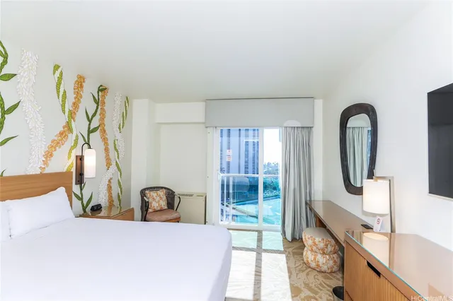 a large white kitchen with a large window