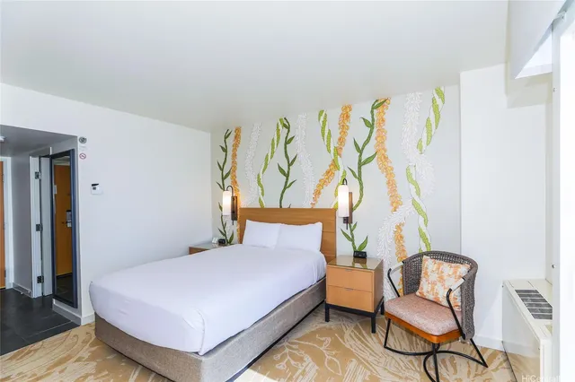 a bedroom with a bed and chair