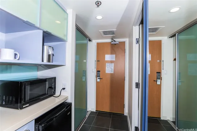 a kitchen with a stove and a microwave