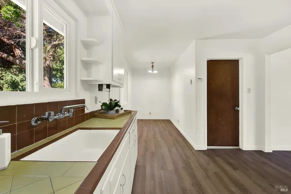 a room with a white walls and a window