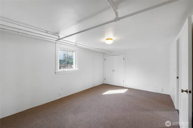 an empty room with a empty space and windows