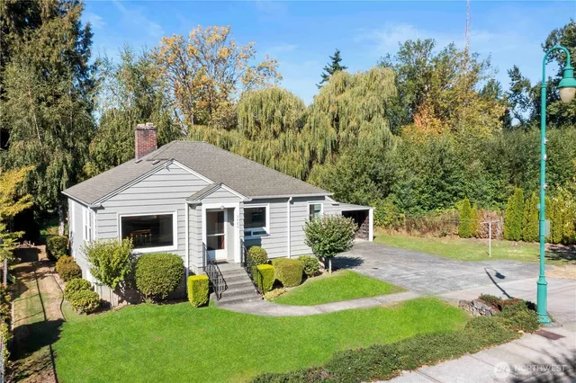 a front view of house with yard and green space