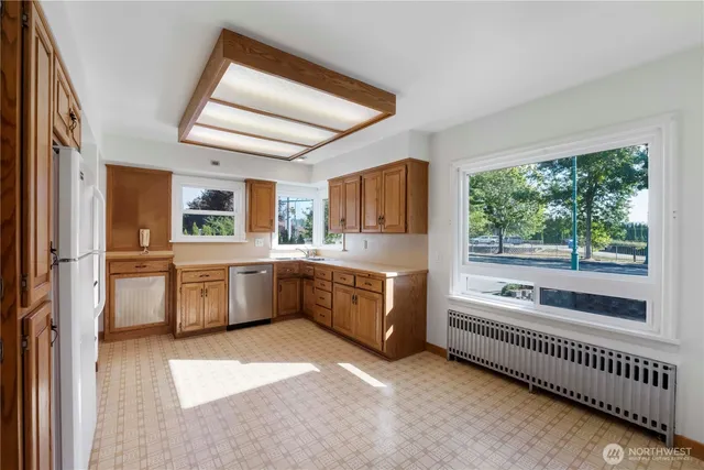 a kitchen with sink cabinets and window