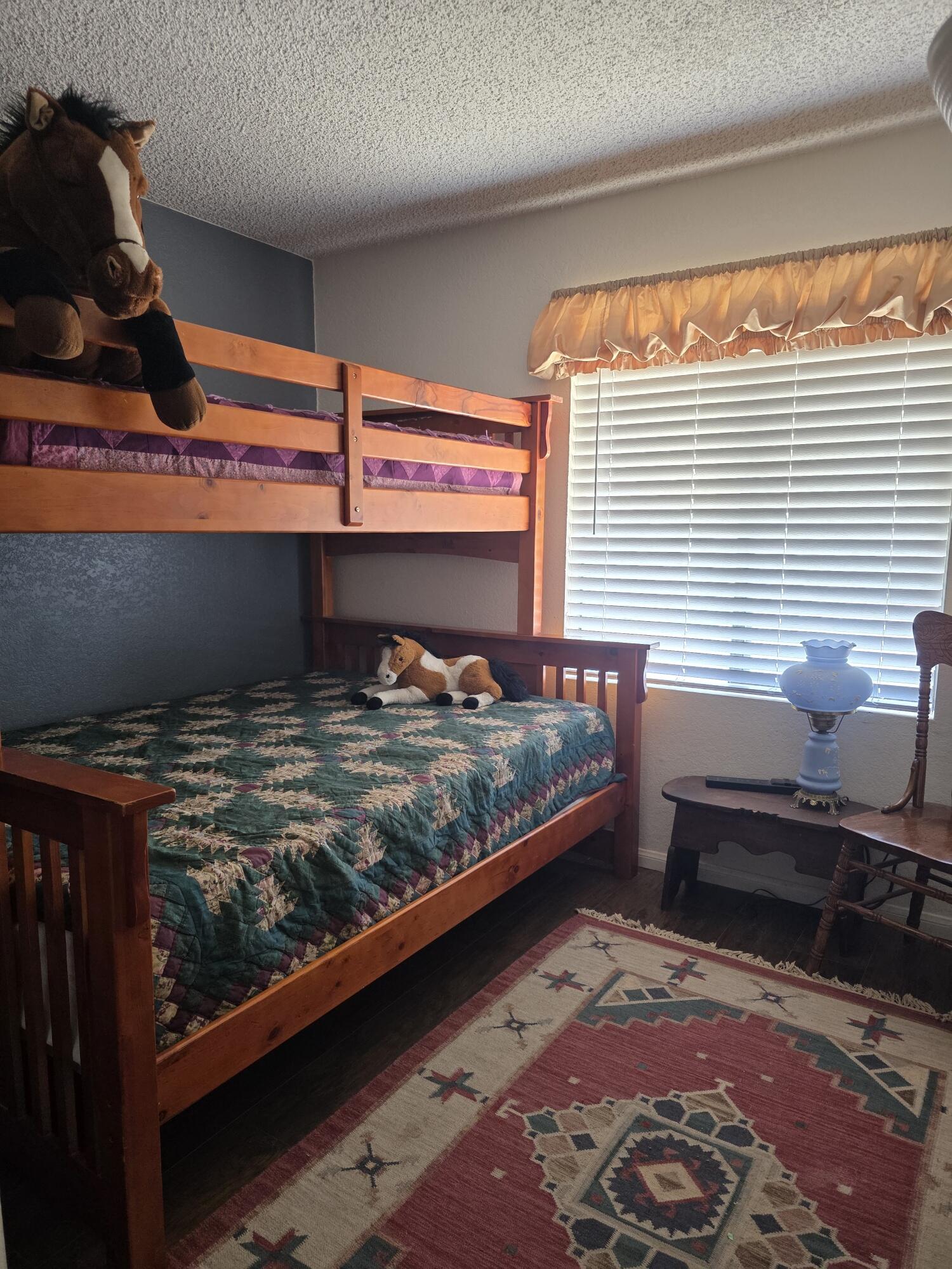 10595 Hot Mineral Spa Road, Unit 228 Niland, CA 92257 - Photo 15 of 38 a bedroom with a bed and a window