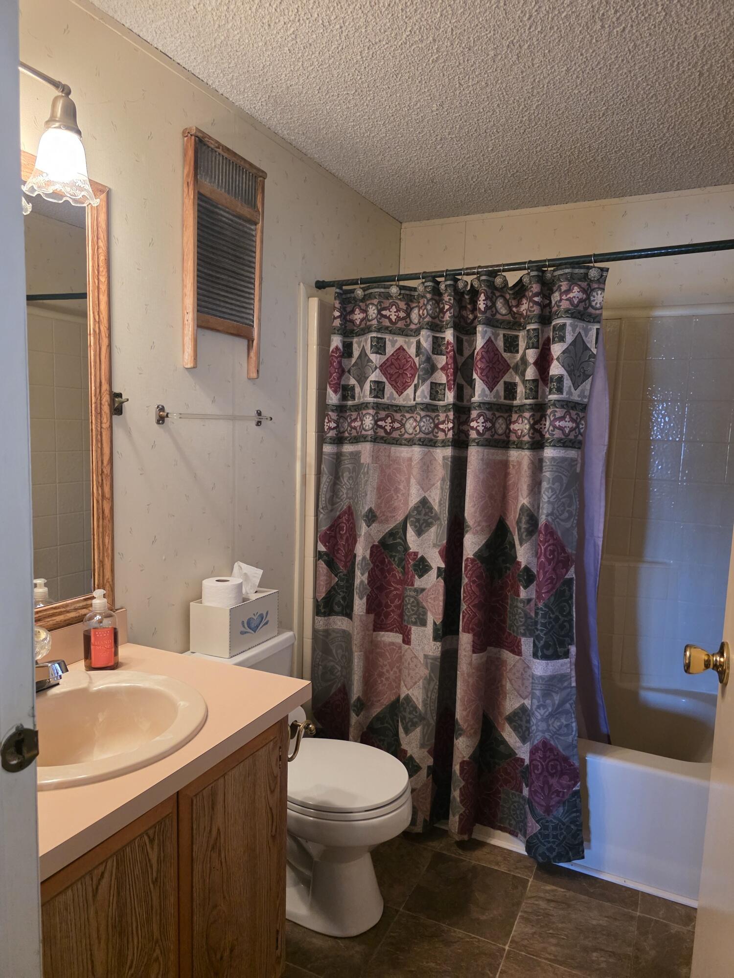 10595 Hot Mineral Spa Road, Unit 228 Niland, CA 92257 - Photo 23 of 38 a bathroom with a sink toilet and shower