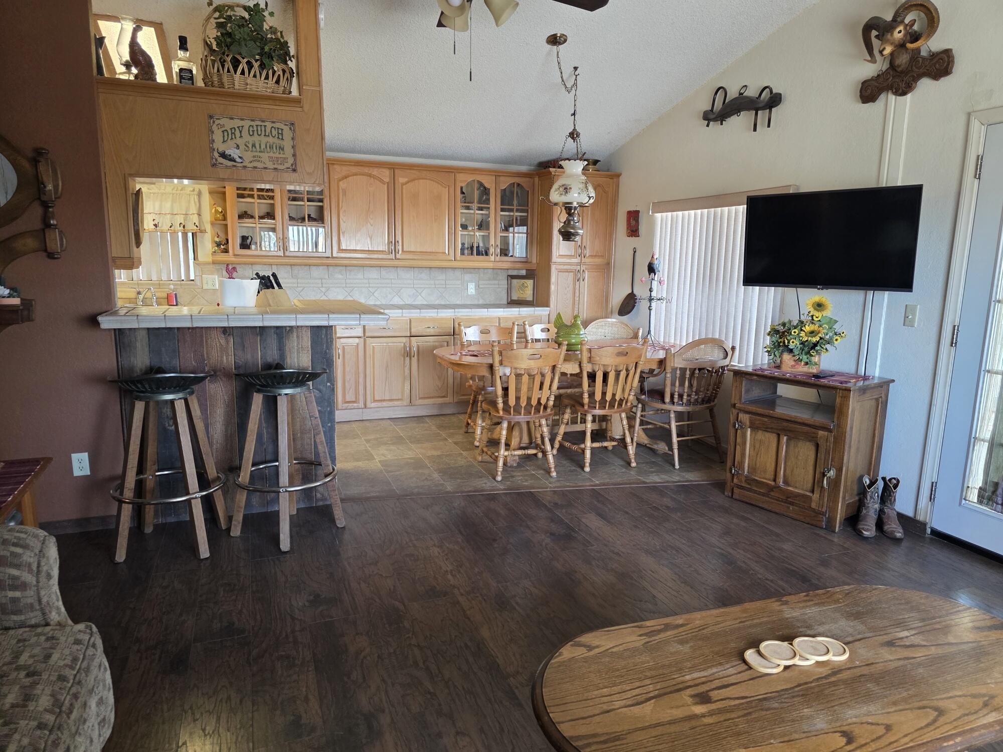 10595 Hot Mineral Spa Road, Unit 228 Niland, CA 92257 - Photo 3 of 38 a view of a dining room with furniture and wooden floor