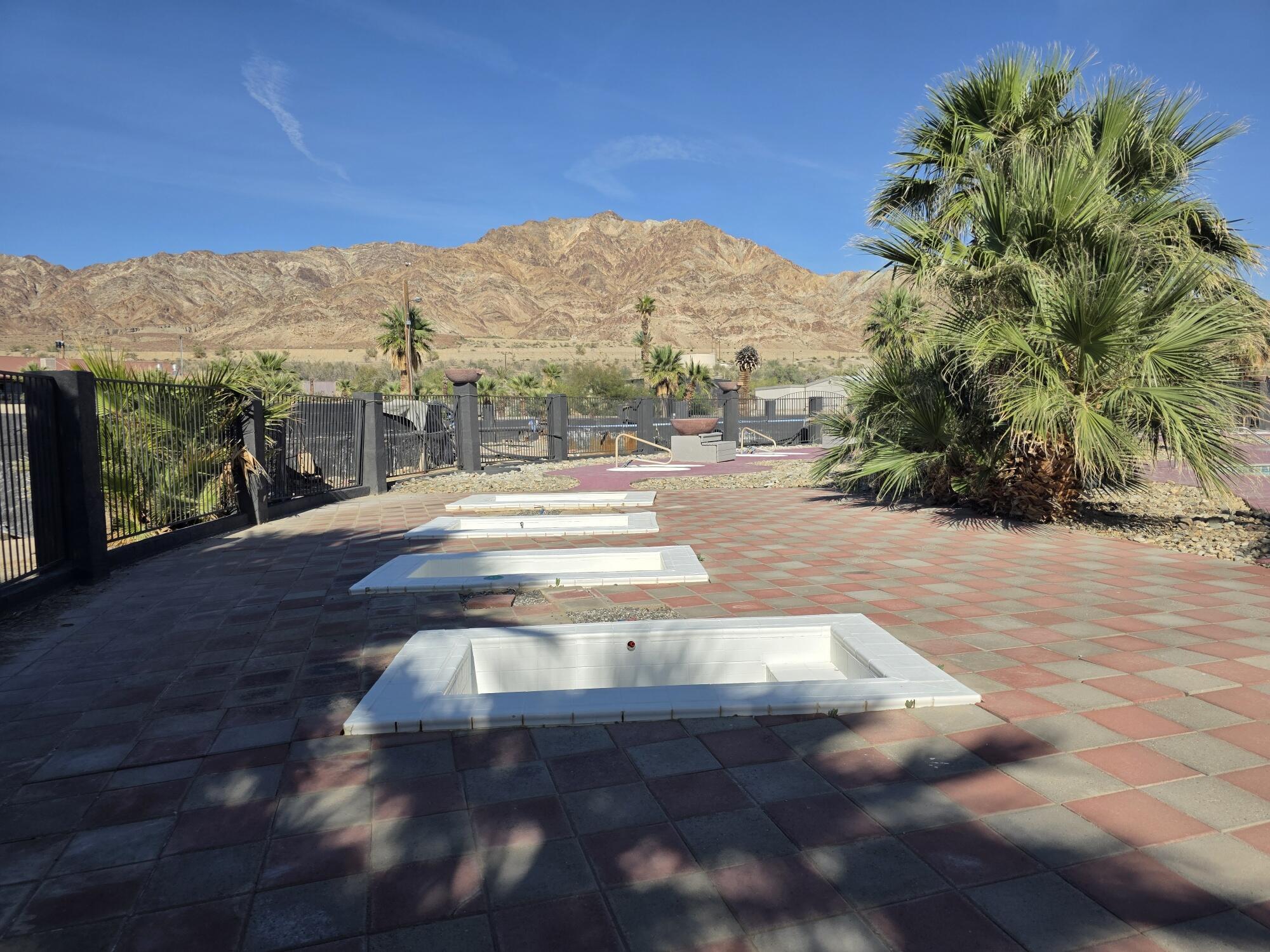 10595 Hot Mineral Spa Road, Unit 228 Niland, CA 92257 - Photo 32 of 38 a view of a yard with a garden