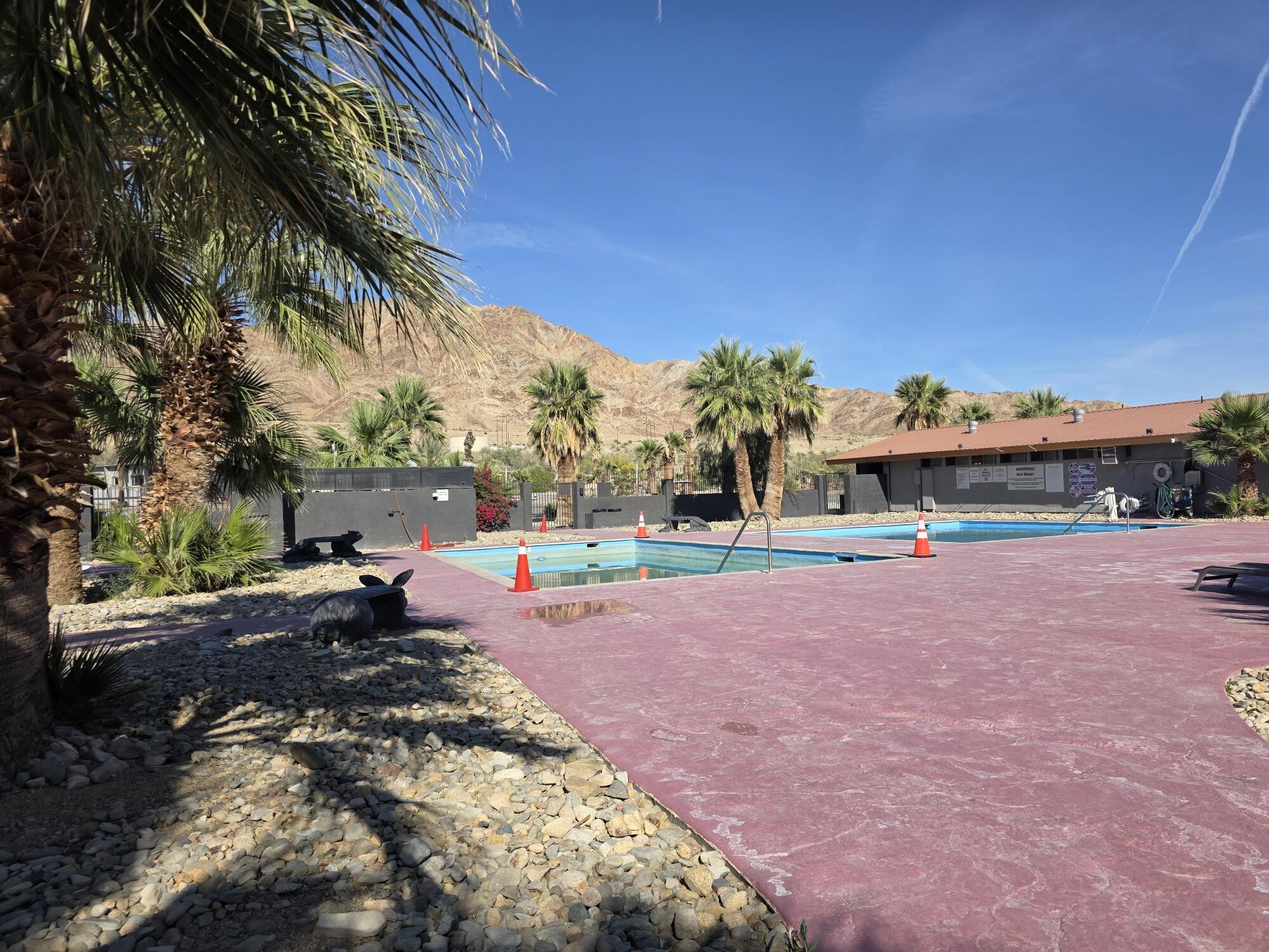 10595 Hot Mineral Spa Road, Unit 228 Niland, CA 92257 - Photo 36 of 38 a view of yard with swimming pool and trees in the background