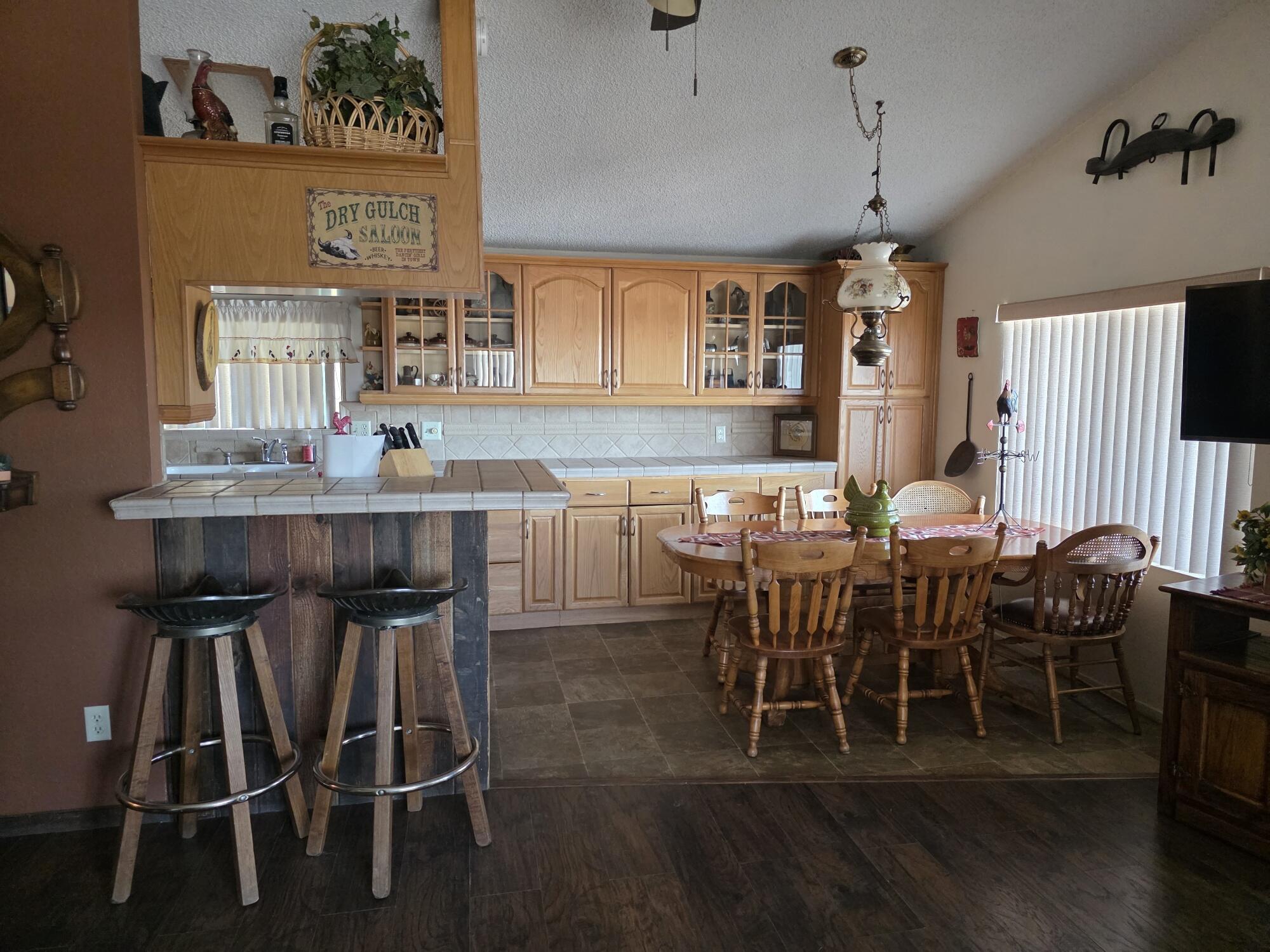 10595 Hot Mineral Spa Road, Unit 228 Niland, CA 92257 - Photo 5 of 38 a view of a dining room with furniture and wooden floor