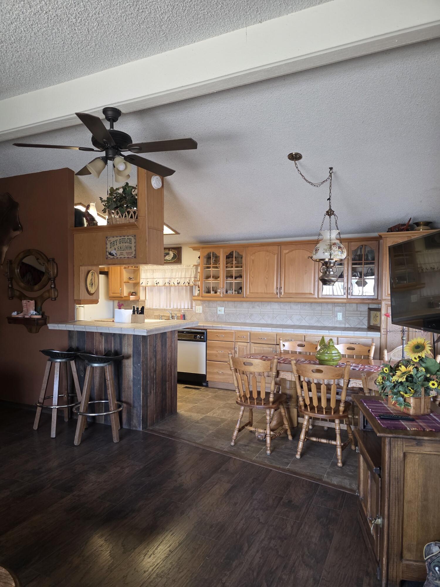 10595 Hot Mineral Spa Road, Unit 228 Niland, CA 92257 - Photo 9 of 38 a view of a dining room with furniture and chandelier