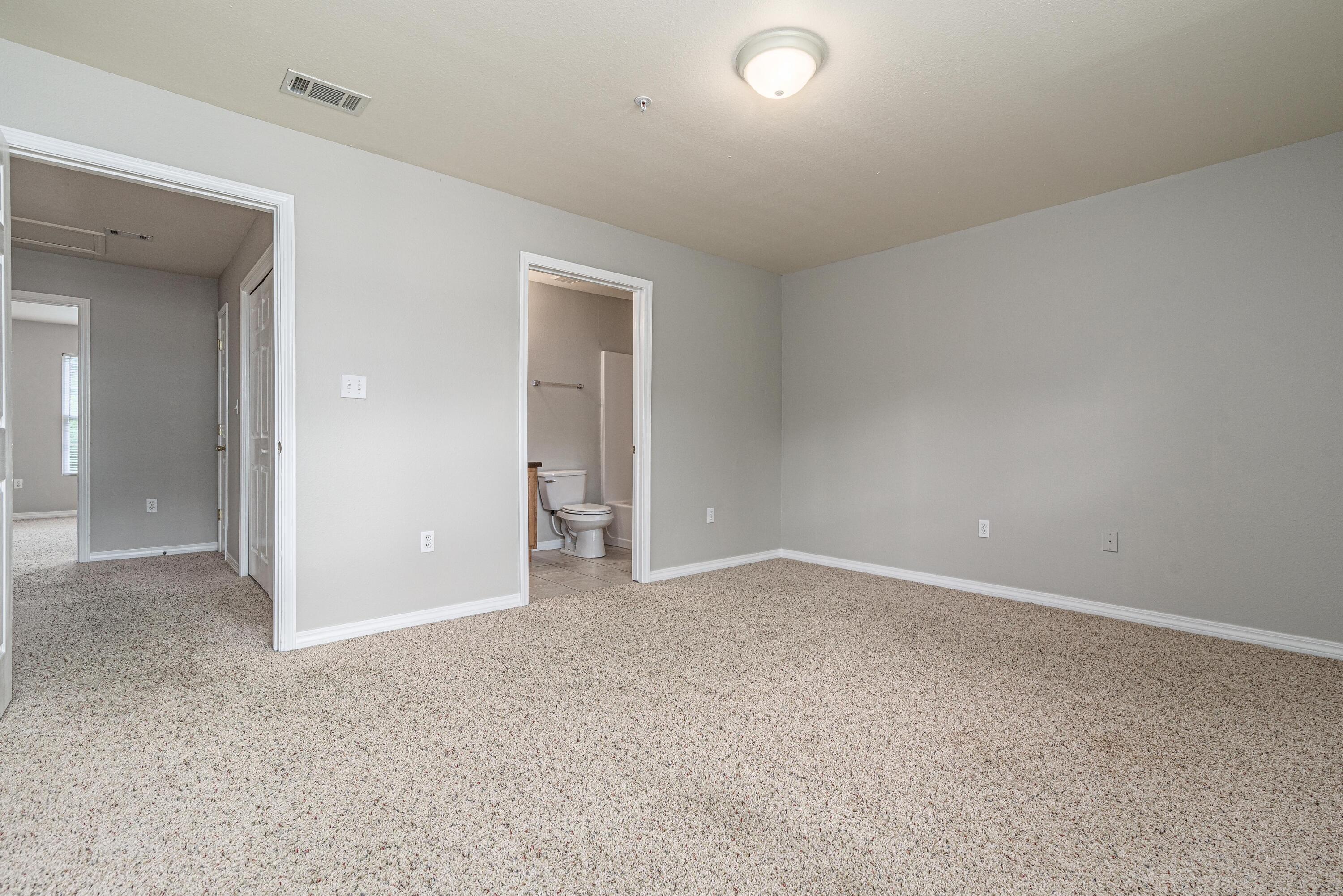 100 Corwin Drive, Unit 100 Crestview, FL 32539 - Photo 22 of 30 an empty room with an entryway