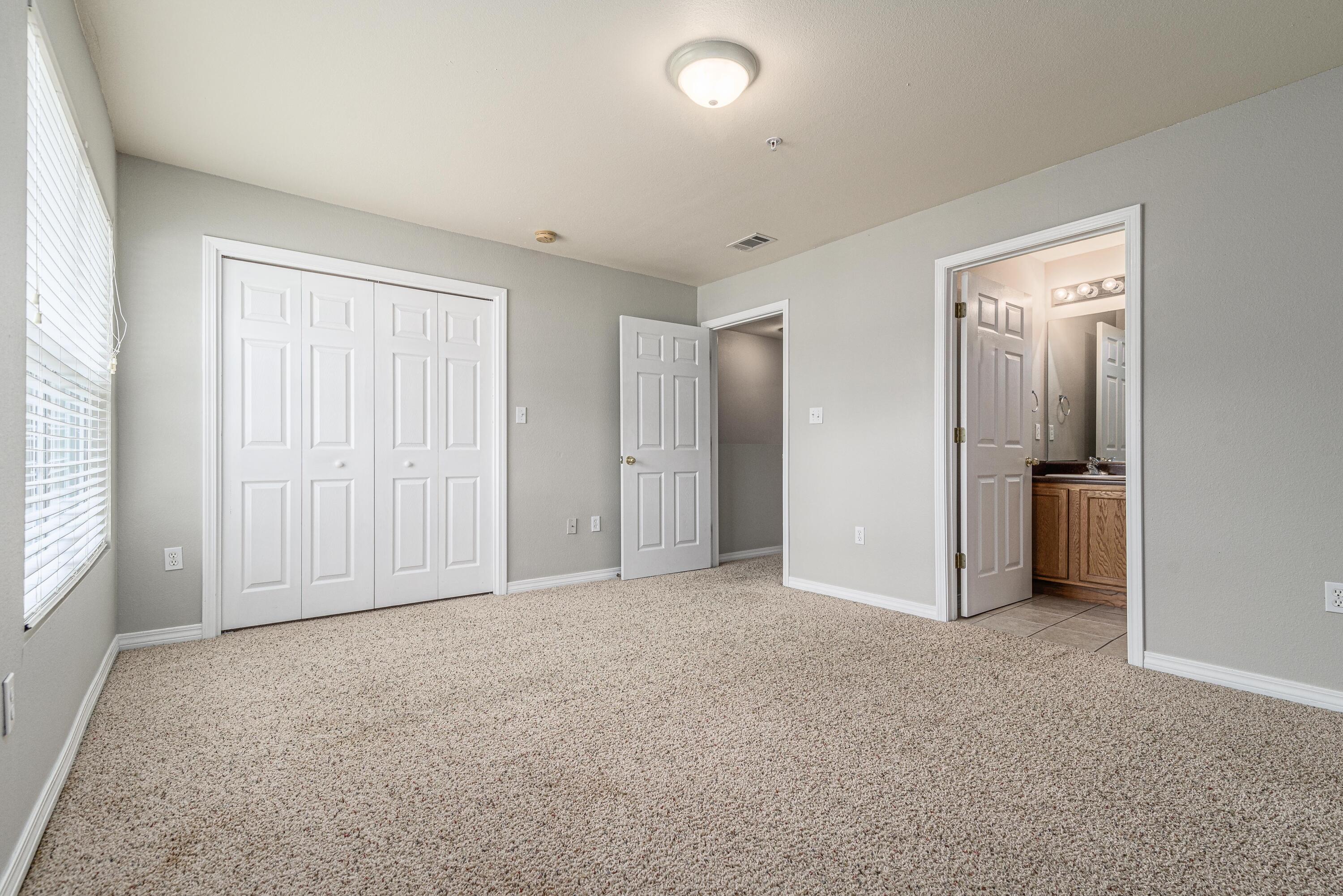 100 Corwin Drive, Unit 100 Crestview, FL 32539 - Photo 23 of 30 an empty room with closet and a window
