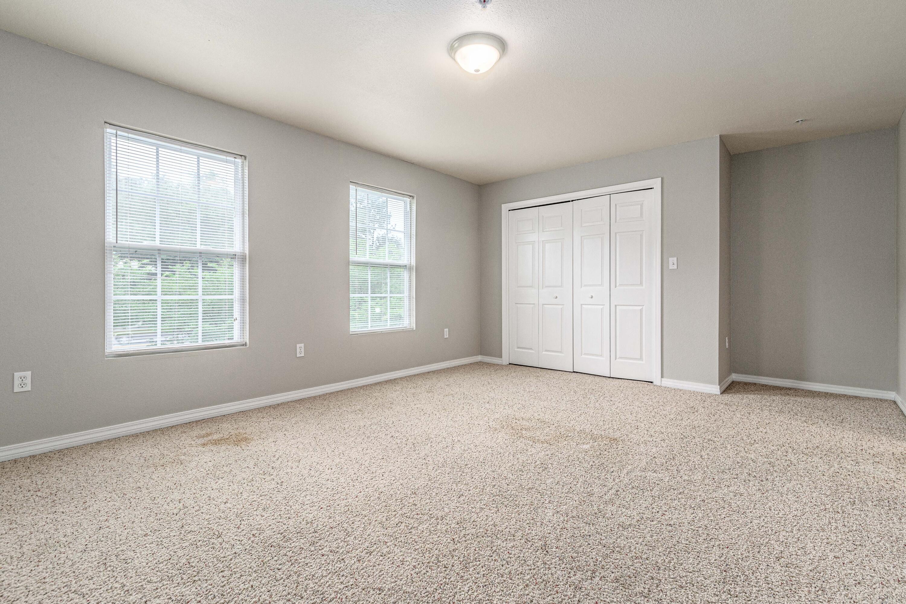 100 Corwin Drive, Unit 100 Crestview, FL 32539 - Photo 25 of 30 an empty room with windows