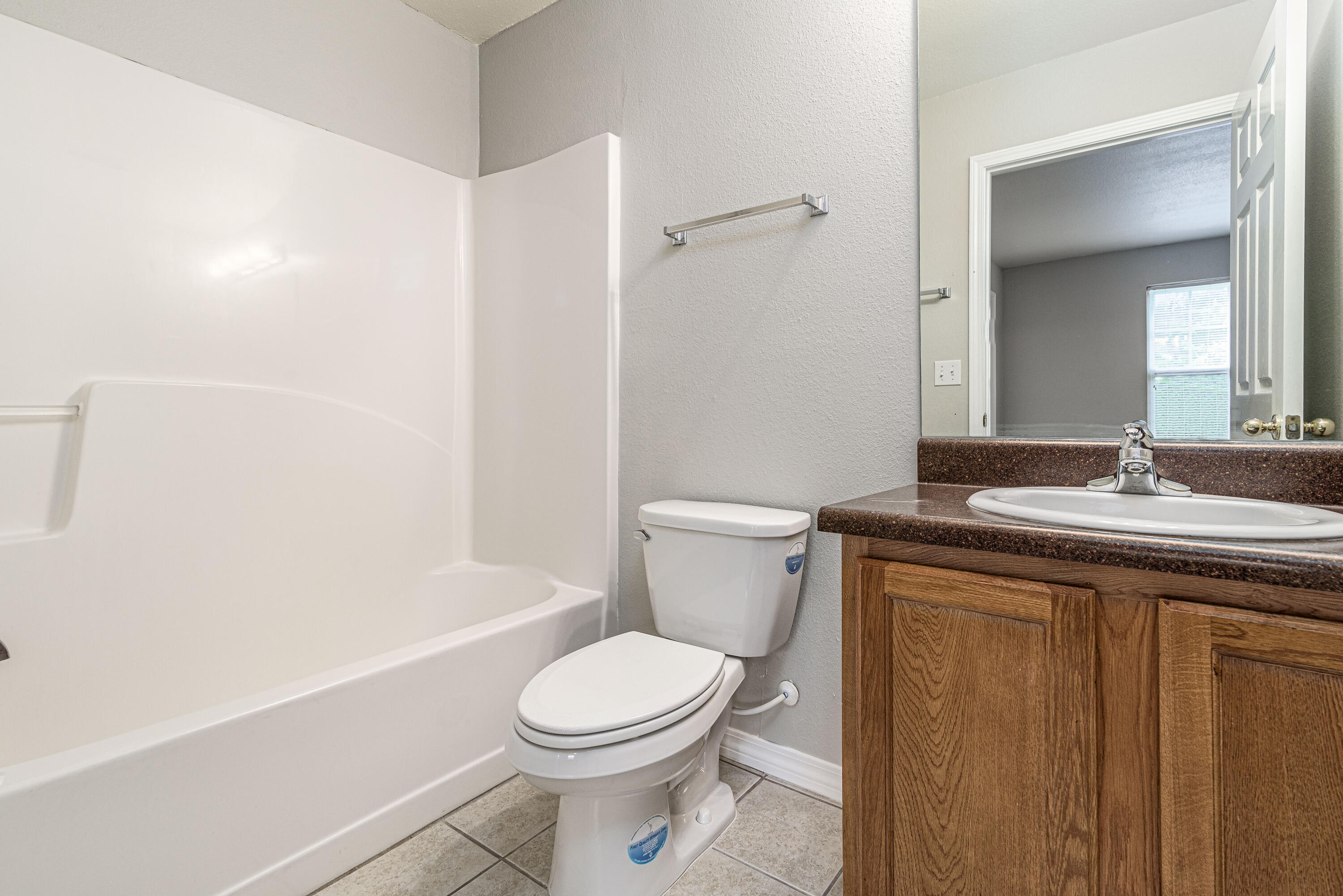 100 Corwin Drive, Unit 100 Crestview, FL 32539 - Photo 29 of 30 a bathroom with a sink a toilet and shower