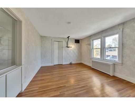 35 Perkins Street Springfield, MA 01118 - Photo 19 of 23 a view of an empty room with wooden floor and a window