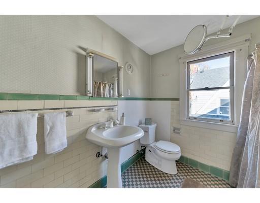 35 Perkins Street Springfield, MA 01118 - Photo 20 of 23 a bathroom with a toilet sink and mirror