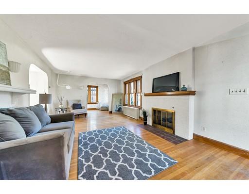35 Perkins Street Springfield, MA 01118 - Photo 2 of 23 a living room with furniture a fireplace and a flat screen tv