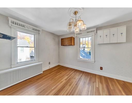 35 Perkins Street Springfield, MA 01118 - Photo 22 of 23 a view of an empty room with wooden floor and a window