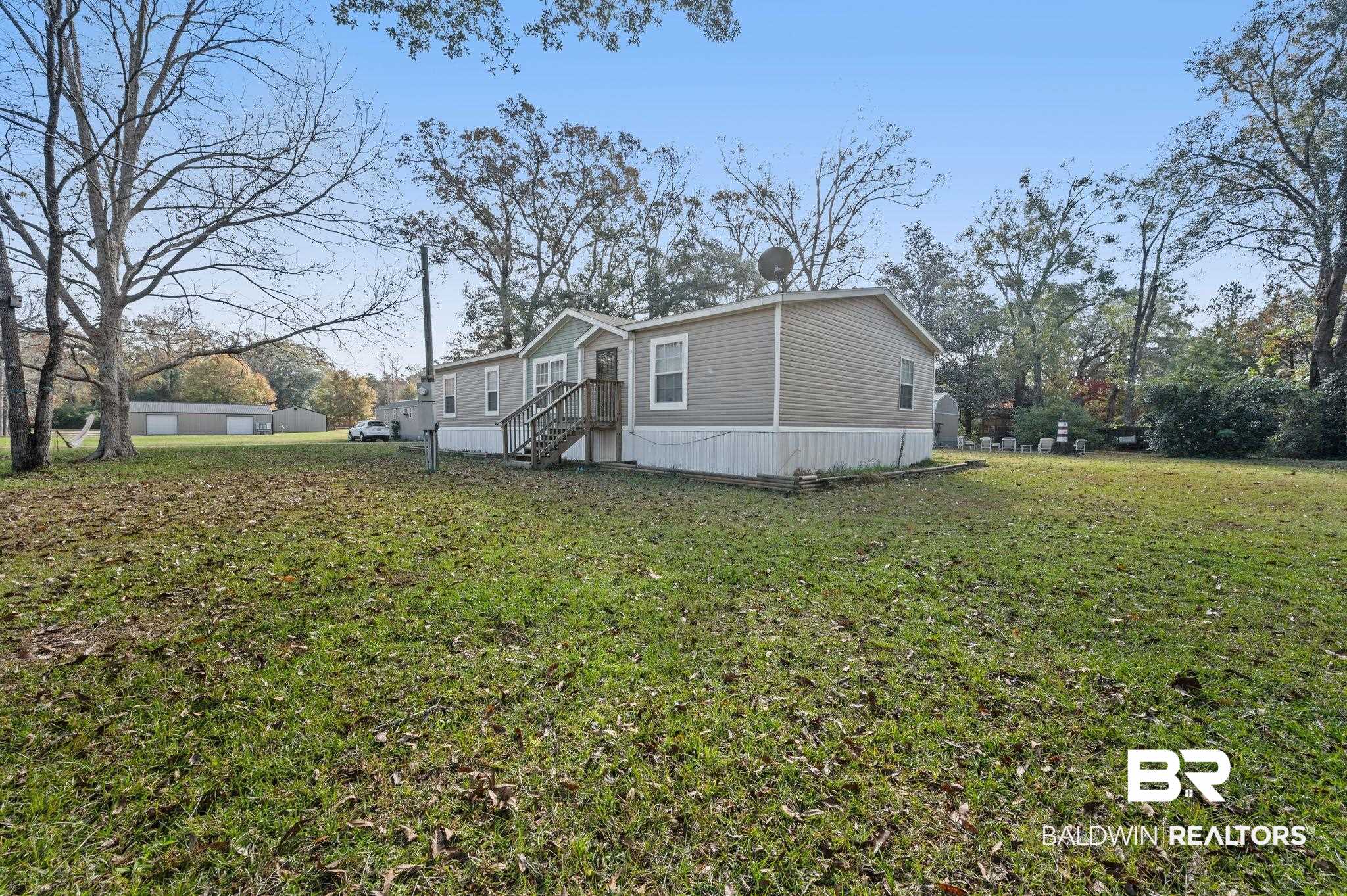 9382 D'Olive Street Bay Minette, AL 36507 - Photo 23 of 27 Back of property with a yard