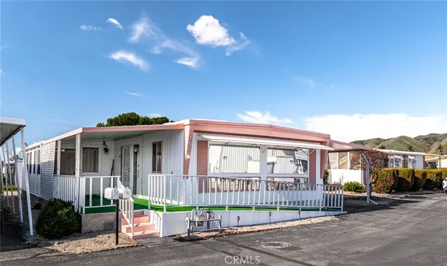 a view of a house with a small yard and plants
