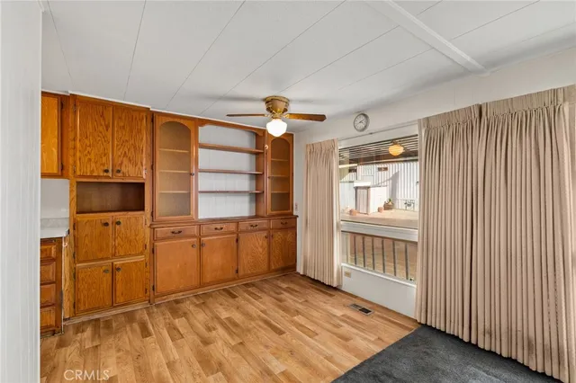 a room with dresser and entryway