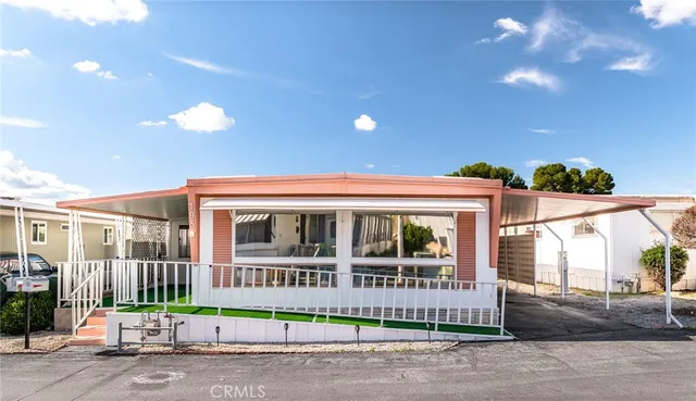 a view of a brick building next to a road