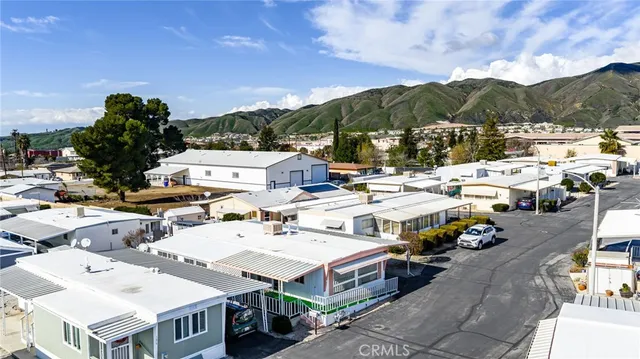 an aerial view of residential houses with parking space