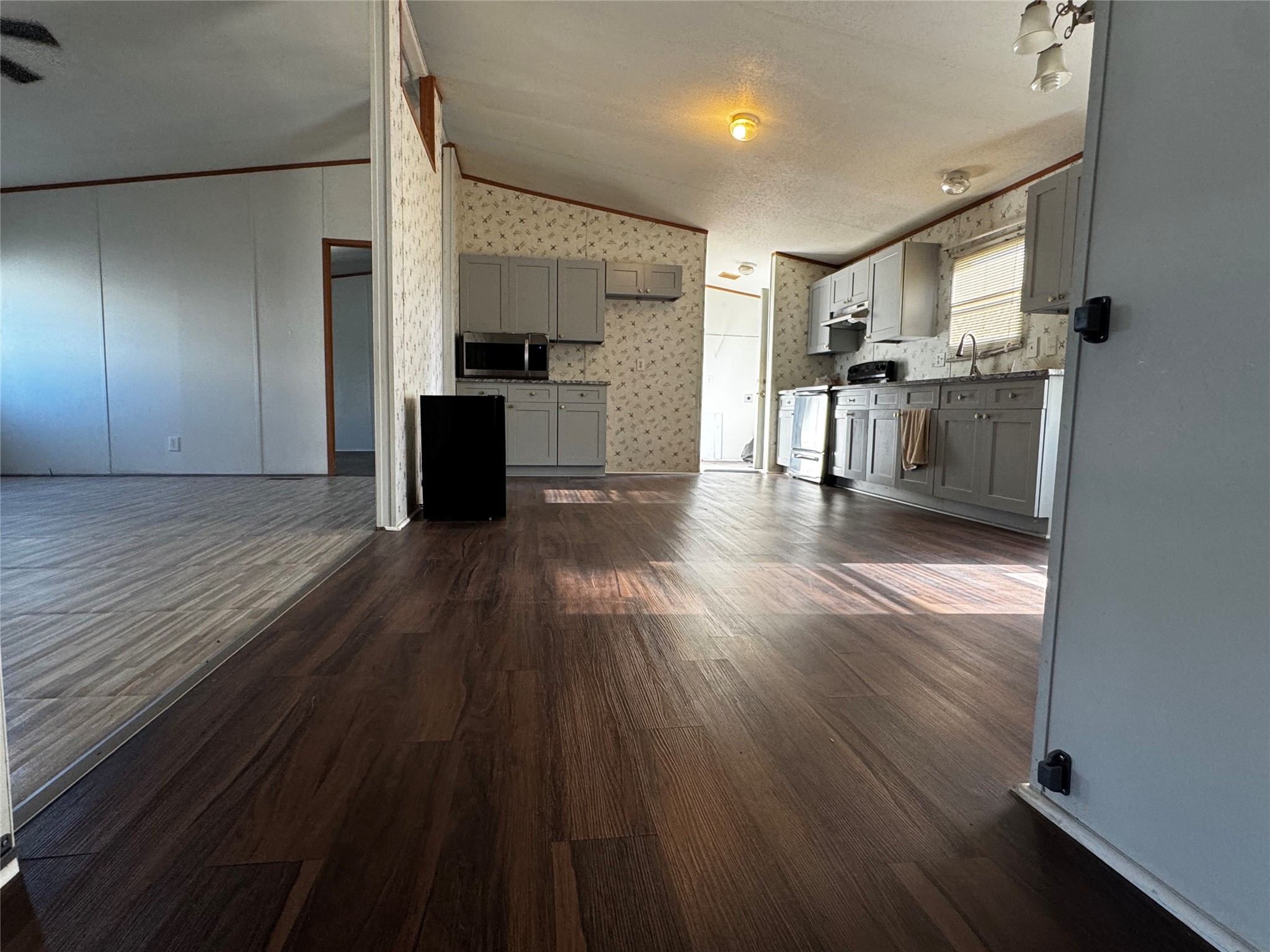 15930 Boss Gaston Road Sugar Land, TX 77498 - Photo 6 of 20 a kitchen with stainless steel appliances granite countertop a refrigerator and a stove top oven