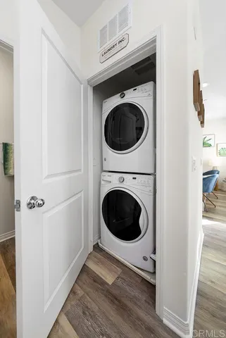 a view of a hallway with washer and dryer