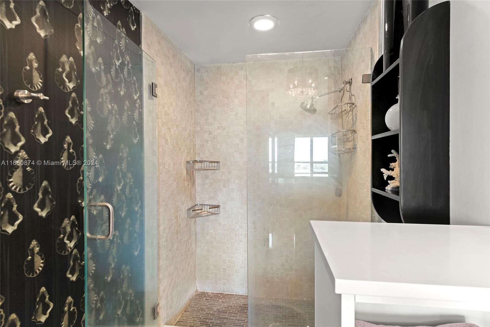 1500 Bay Road, Unit 1524S Miami Beach, FL 33139 - Photo 17 of 40 a bathroom with a bathtub and shower