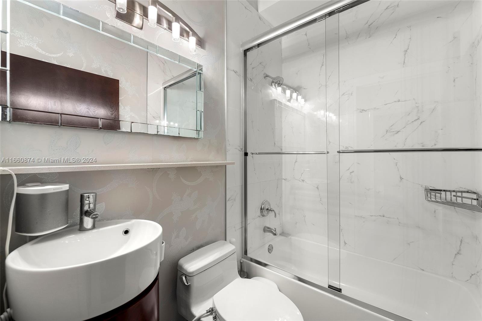 1500 Bay Road, Unit 1524S Miami Beach, FL 33139 - Photo 21 of 40 a bathroom with a toilet sink and shower