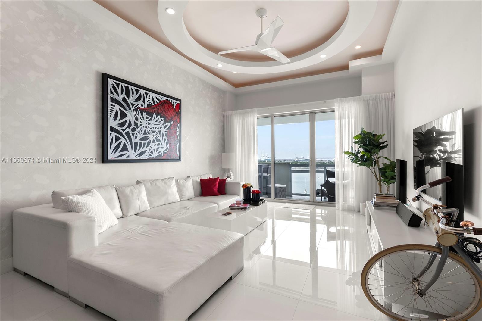 1500 Bay Road, Unit 1524S Miami Beach, FL 33139 - Photo 4 of 40 a living room with furniture and a flat screen tv