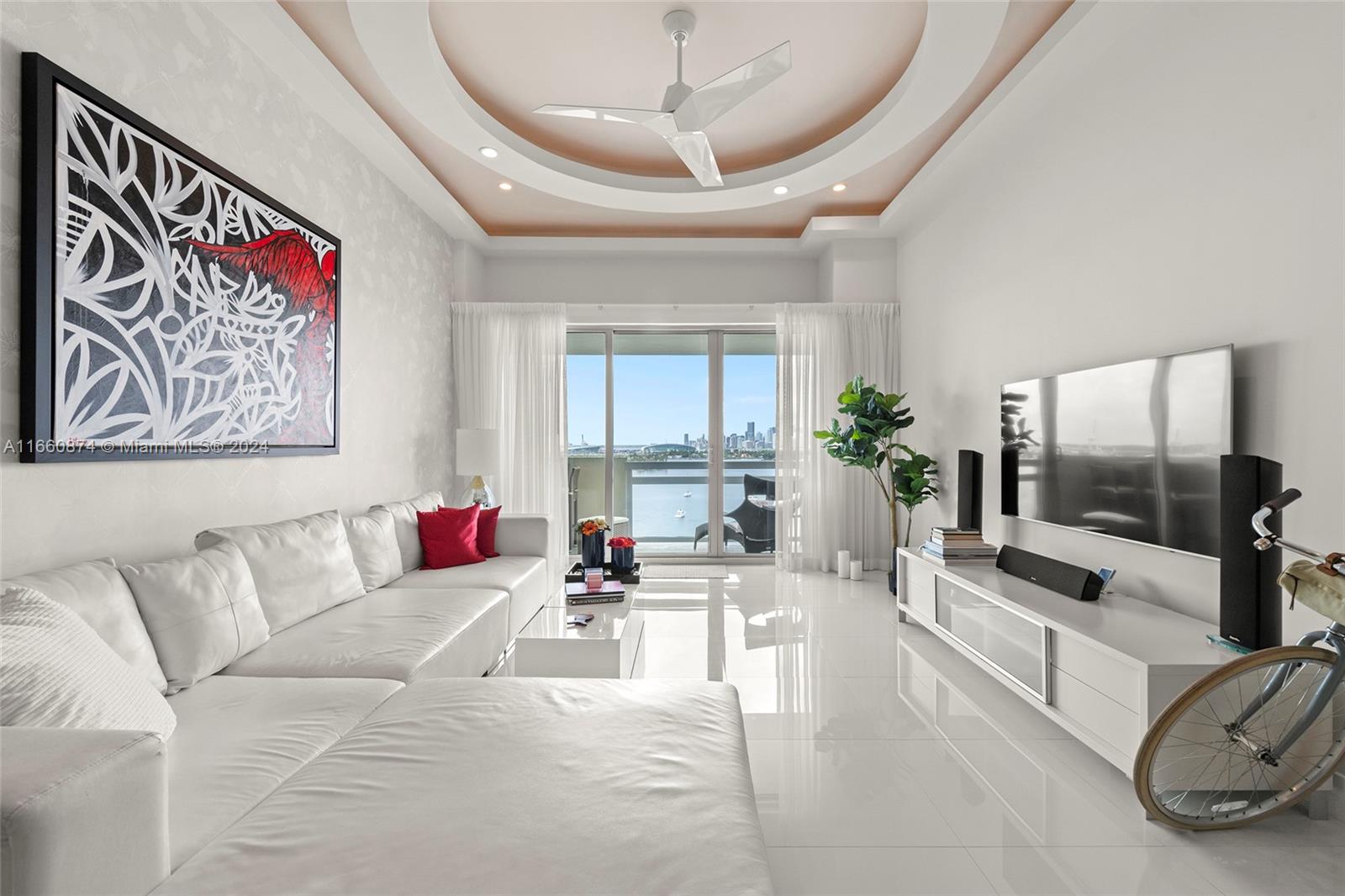 1500 Bay Road, Unit 1524S Miami Beach, FL 33139 - Photo 5 of 40 a living room with furniture and a flat screen tv
