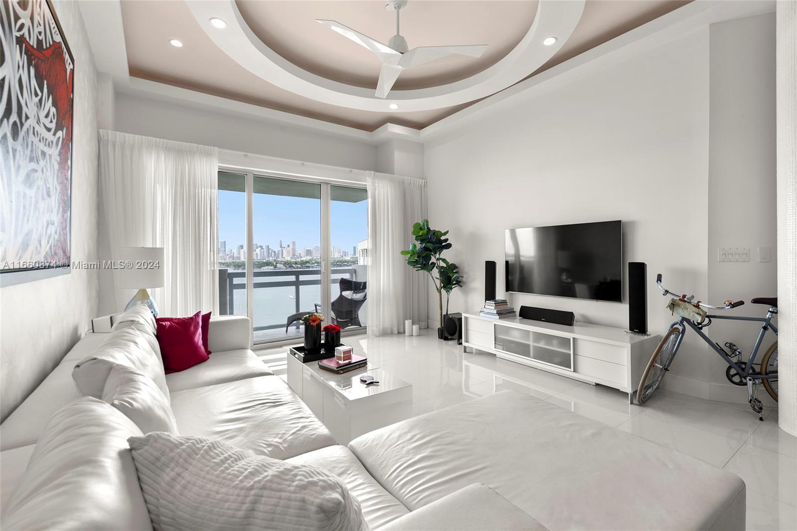 1500 Bay Road, Unit 1524S Miami Beach, FL 33139 - Photo 6 of 40 a living room with furniture and a flat screen tv