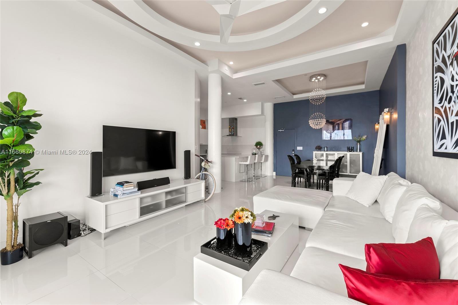 1500 Bay Road, Unit 1524S Miami Beach, FL 33139 - Photo 7 of 40 a living room with furniture and a flat screen tv