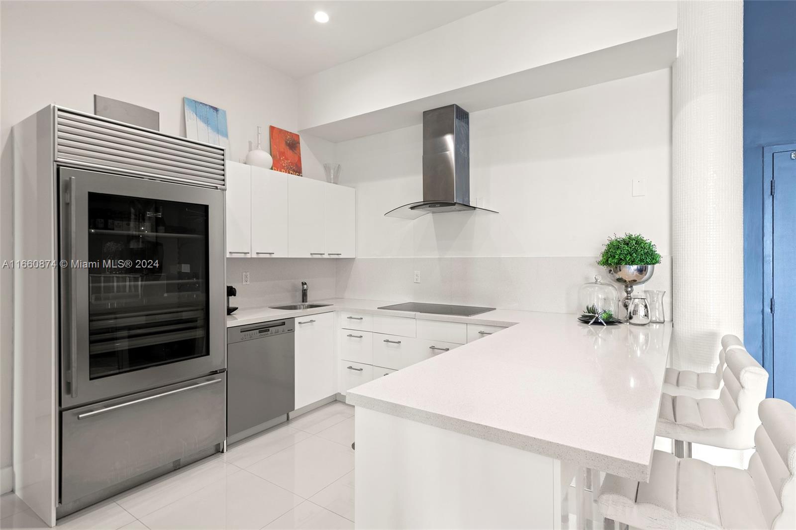 1500 Bay Road, Unit 1524S Miami Beach, FL 33139 - Photo 8 of 40 a kitchen with a sink and stove
