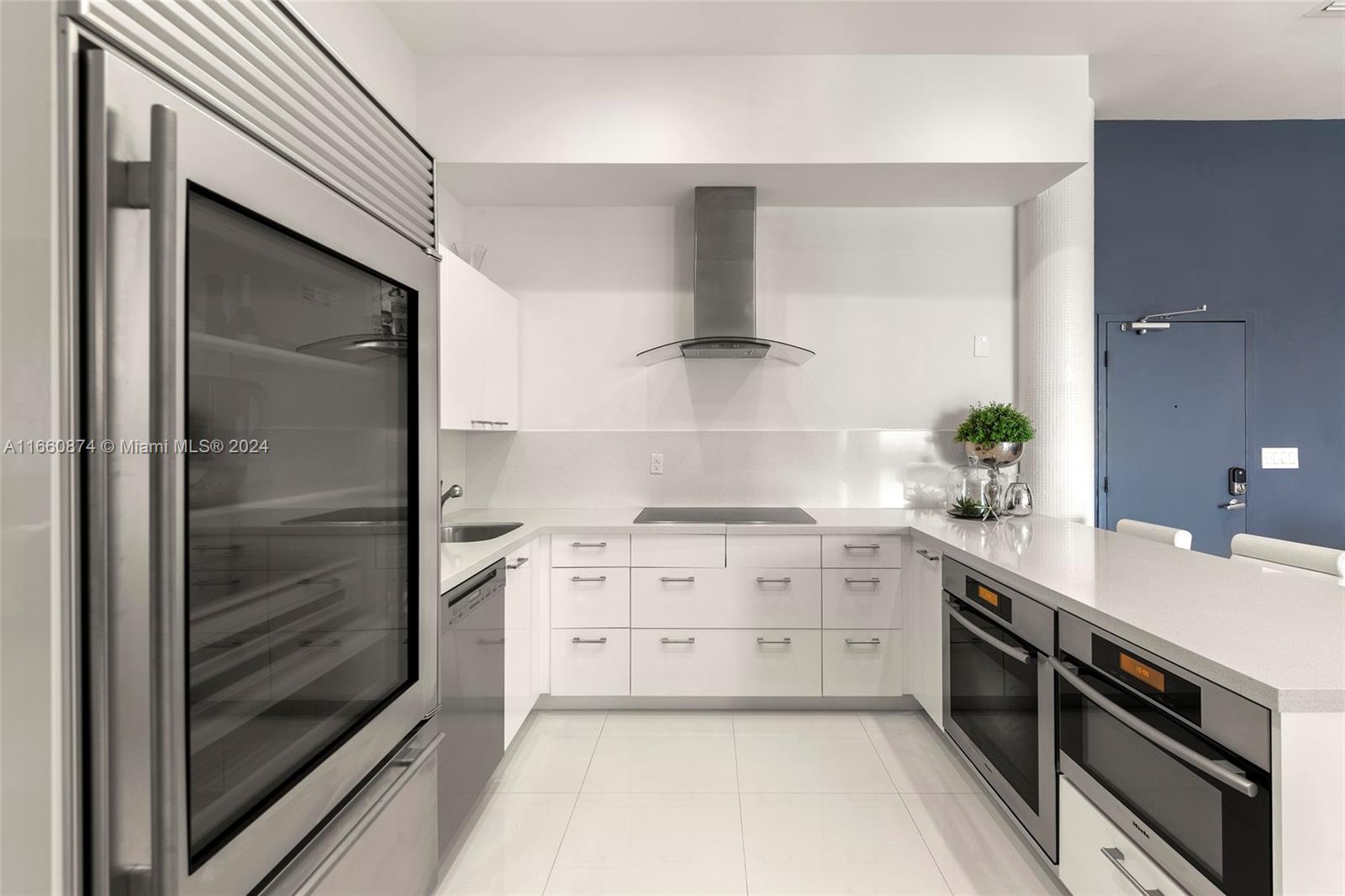 1500 Bay Road, Unit 1524S Miami Beach, FL 33139 - Photo 9 of 40 a kitchen with a stove oven and sink