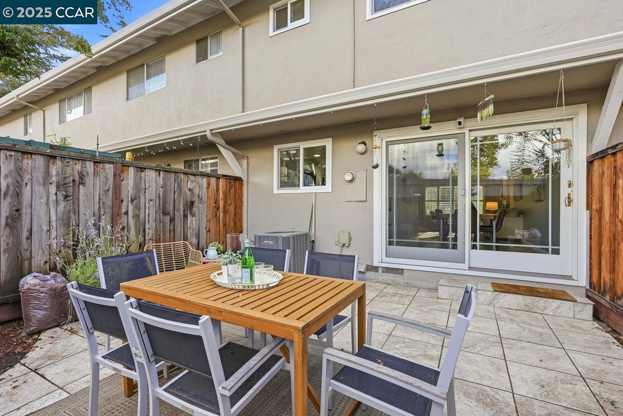 37 Miramonte Drive Moraga, CA 94556 - Photo 23 of 42 a view of a patio with table and chairs with wooden floor and fence