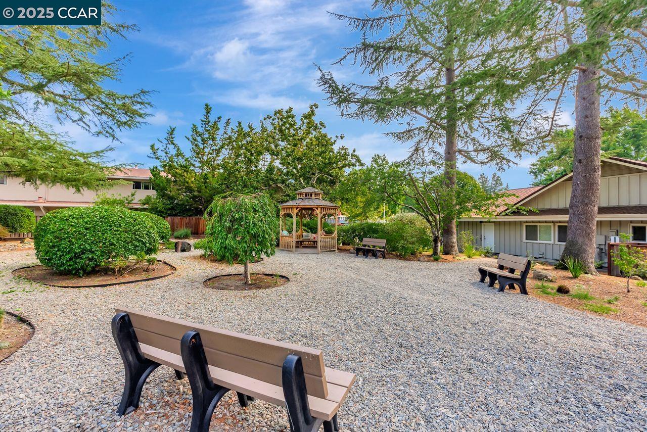 37 Miramonte Drive Moraga, CA 94556 - Photo 26 of 42 a backyard of a house with table and chairs