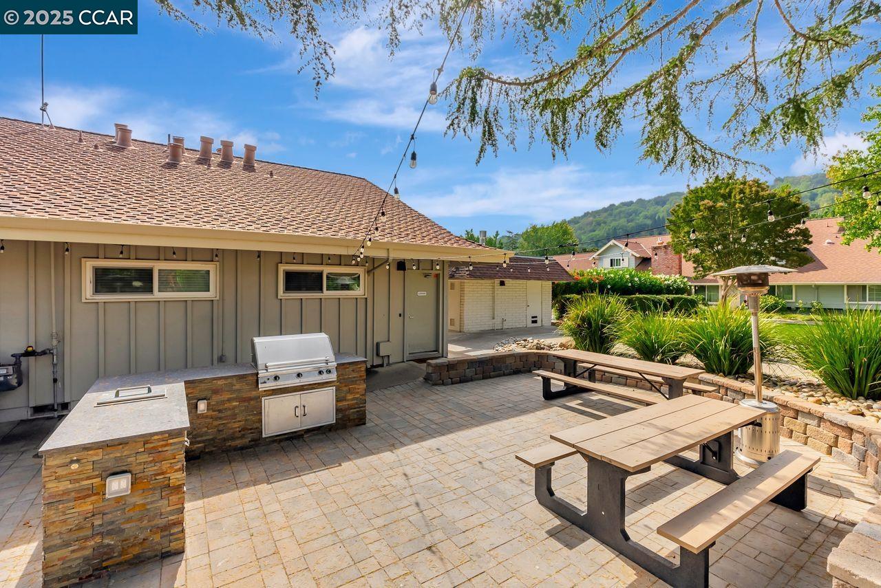 37 Miramonte Drive Moraga, CA 94556 - Photo 28 of 42 a backyard of a house with barbeque oven table and chairs