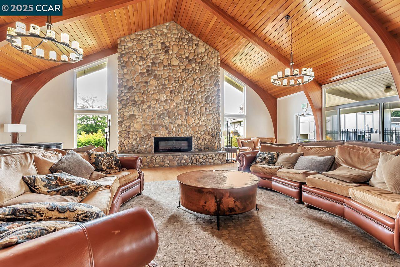 37 Miramonte Drive Moraga, CA 94556 - Photo 32 of 42 a living room with furniture a fireplace and a flat screen tv