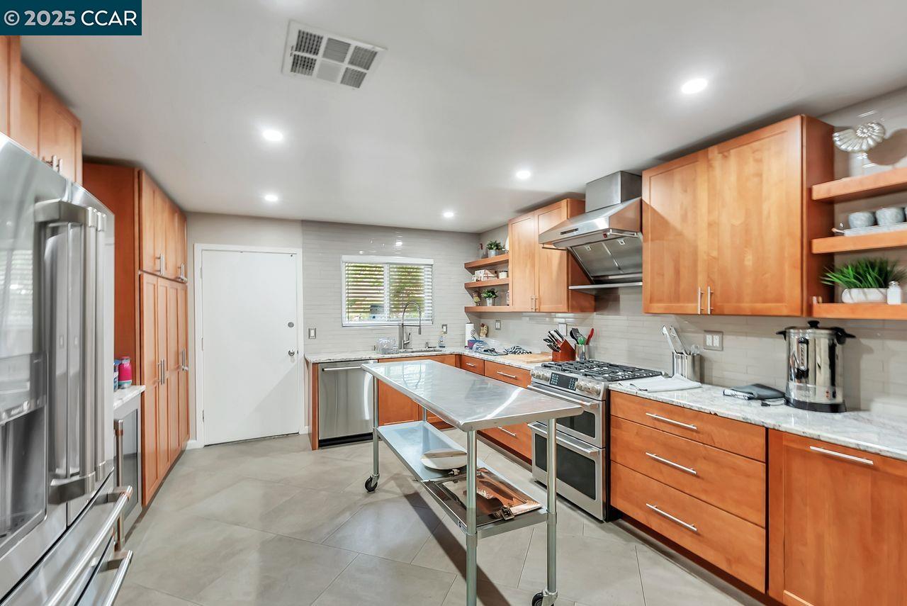 37 Miramonte Drive Moraga, CA 94556 - Photo 36 of 42 a kitchen that has a lot of cabinets in it and appliances