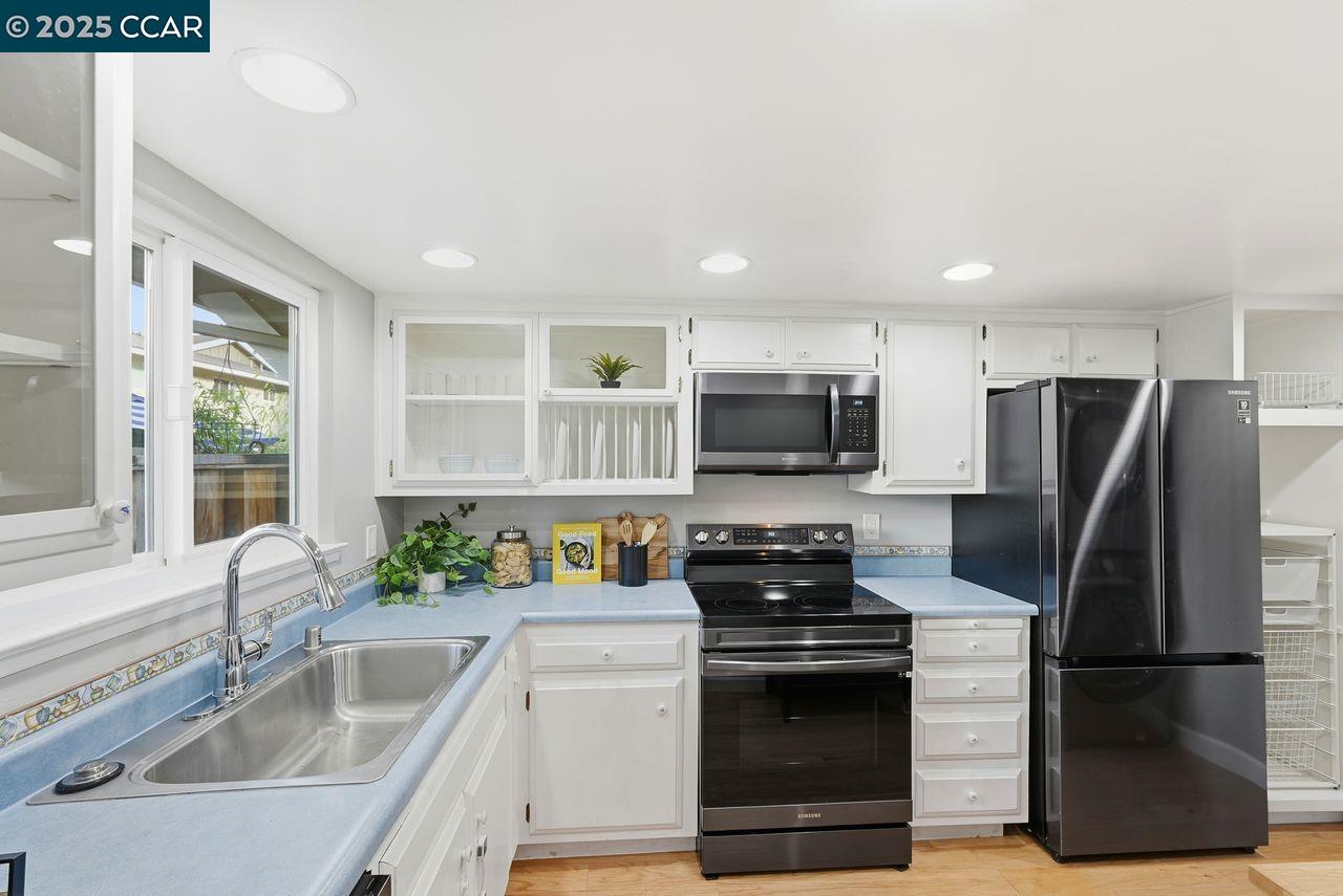 37 Miramonte Drive Moraga, CA 94556 - Photo 6 of 42 a kitchen with stainless steel appliances a refrigerator sink and microwave