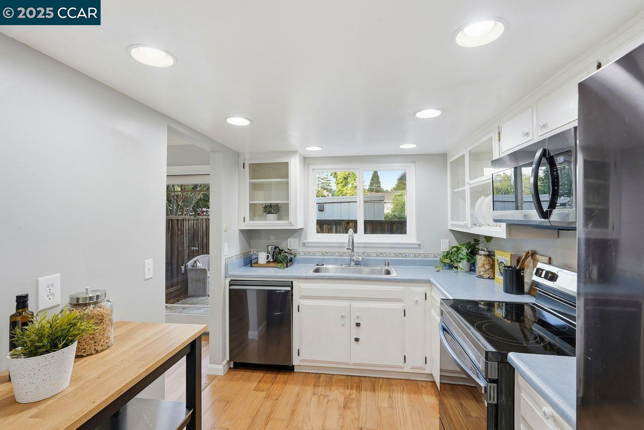37 Miramonte Drive Moraga, CA 94556 - Photo 7 of 42 a kitchen that has a sink and a stove in it