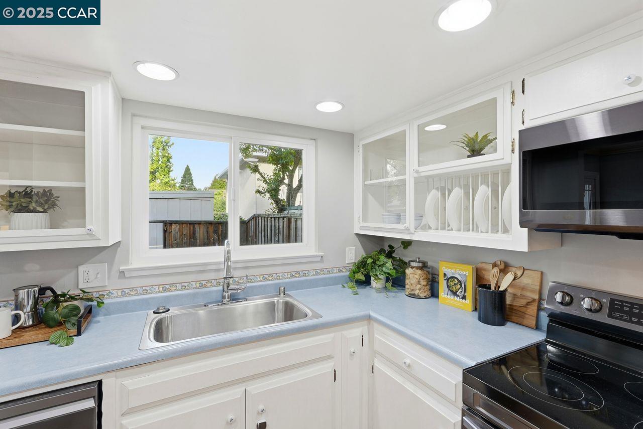 37 Miramonte Drive Moraga, CA 94556 - Photo 8 of 42 a kitchen with a sink a stove and cabinets
