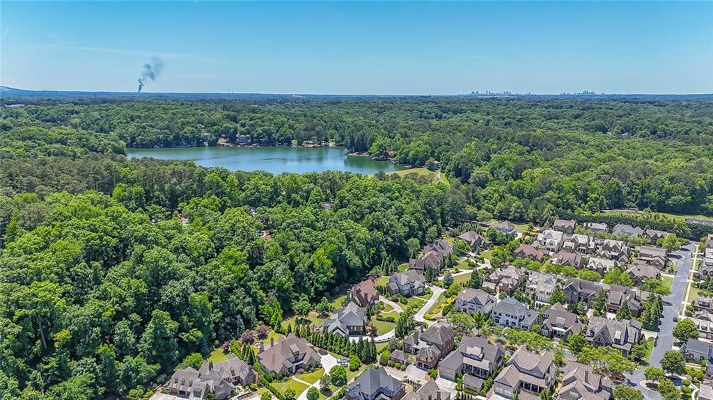 3712 Frederica Road Northwest Berkeley Lake, GA 30096 - Photo 48 of 49 a view of a lake with a city