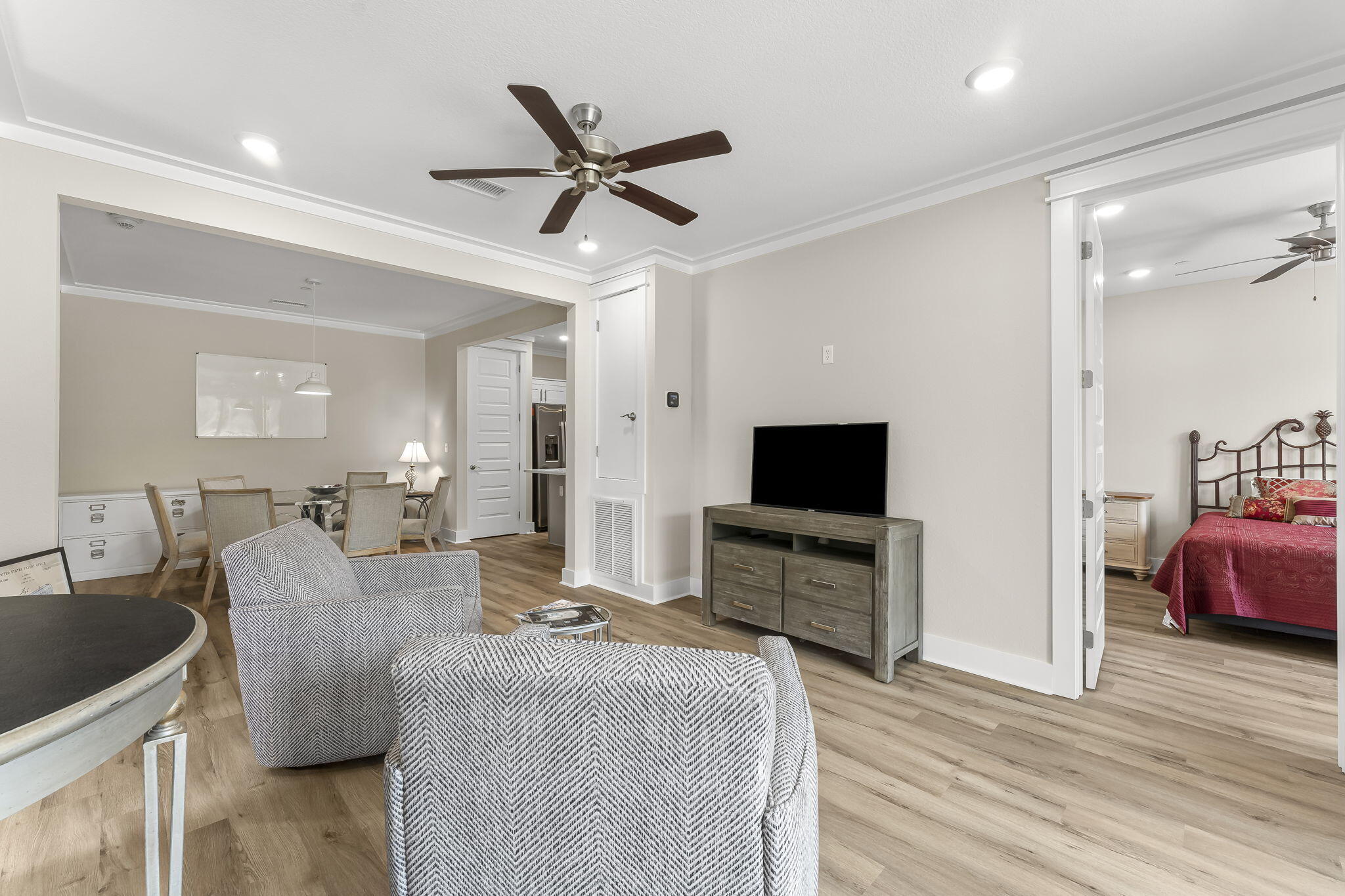 725 J D Miller Road, Unit 106 Santa Rosa Beach, FL 32459 - Photo 11 of 19 a living room with furniture and a flat screen tv